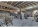 Unfinished basement with exposed wood beams, concrete walls, and ample space for customization at 1751 S Centennial Ave, New Palestine, IN 46163