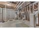 Unfinished basement with concrete floor, exposed ceiling joists, and utilities at 1751 S Centennial Ave, New Palestine, IN 46163
