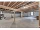 Large unfinished basement with exposed joists, concrete floor, and a window at 1751 S Centennial Ave, New Palestine, IN 46163