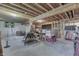 Unfinished basement with exposed wood beams, concrete walls, and ample space for customization at 1751 S Centennial Ave, New Palestine, IN 46163