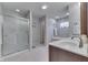 Bathroom with walk-in shower, soaking tub, double sink vanity, and neutral decor at 1751 S Centennial Ave, New Palestine, IN 46163