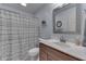This bathroom features blue walls, a shower with curtain, a vanity and modern fixtures at 1751 S Centennial Ave, New Palestine, IN 46163