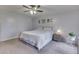 Bright bedroom with neutral tones, carpeted floor, bedside table, and a window at 1751 S Centennial Ave, New Palestine, IN 46163