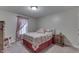 Comfortable bedroom features a rocking chair, wood nightstand and soft, natural light from the window at 1751 S Centennial Ave, New Palestine, IN 46163