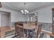 Traditional dining room with wainscoting, stylish table, and plush chairs perfect for Gathering gatherings at 1751 S Centennial Ave, New Palestine, IN 46163