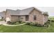 A beautiful brick home with professional landscaping and a well-maintained lawn, offering great curb appeal at 1751 S Centennial Ave, New Palestine, IN 46163