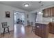 Open concept kitchen with granite countertops and stainless steel appliances flows into sun-filled breakfast nook at 1751 S Centennial Ave, New Palestine, IN 46163