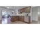 Stylish kitchen with hardwood floors, granite countertops, and stainless steel appliances opens to sunny breakfast nook at 1751 S Centennial Ave, New Palestine, IN 46163