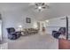 Spacious living room with vaulted ceilings, comfortable seating, and an open layout at 1751 S Centennial Ave, New Palestine, IN 46163