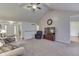 Airy living room featuring vaulted ceilings, with views of the home's entry and dining area at 1751 S Centennial Ave, New Palestine, IN 46163