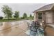 Outdoor patio with table and chairs next to the pool, creating an inviting space for relaxation and entertaining at 1751 S Centennial Ave, New Palestine, IN 46163
