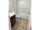 Bathroom with a vanity, toilet, and shower-tub combo with neutral tile flooring at 1774 Blue Grass Pkwy, Greenwood, IN 46143