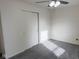 The bedroom contains a sliding door closet and gray carpet at 1774 Blue Grass Pkwy, Greenwood, IN 46143