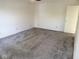 Spacious bedroom with plush carpet and ample natural light creating a cozy and inviting atmosphere at 1774 Blue Grass Pkwy, Greenwood, IN 46143