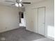 A bedroom features a double door closet and an open doorway at 1774 Blue Grass Pkwy, Greenwood, IN 46143