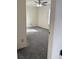 Bright bedroom featuring neutral walls, plush carpeting, and a ceiling fan with light fixture at 1774 Blue Grass Pkwy, Greenwood, IN 46143
