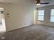 Bright bedroom featuring plush carpet, neutral walls, and abundant natural light from large windows at 1774 Blue Grass Pkwy, Greenwood, IN 46143