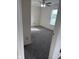 Sunlit bedroom with neutral walls, plush gray carpeting, and a ceiling fan at 1774 Blue Grass Pkwy, Greenwood, IN 46143