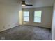 This bedroom has neutral walls and two windows with a view to the outside at 1774 Blue Grass Pkwy, Greenwood, IN 46143