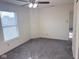 Well-lit bedroom with plush carpeting, featuring natural light from a window at 1774 Blue Grass Pkwy, Greenwood, IN 46143