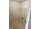 Utility closet showcasing built-in shelving and hookups, offering practical storage solutions at 1774 Blue Grass Pkwy, Greenwood, IN 46143