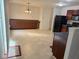 Bright dining area featuring ample cabinet space, complemented by modern black appliances at 1774 Blue Grass Pkwy, Greenwood, IN 46143