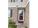Close up of the front entrance, showcasing the brick facade and well-lit entryway at 1774 Blue Grass Pkwy, Greenwood, IN 46143