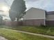 Well-maintained exterior with a mix of brick and siding, complemented by a neatly manicured lawn at 1774 Blue Grass Pkwy, Greenwood, IN 46143