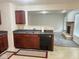 A sink and dishwasher are set in cabinets between the kitchen and living room at 1774 Blue Grass Pkwy, Greenwood, IN 46143