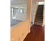 View of stairs and hardwood floors connecting to living space with a stone fireplace at 1774 Blue Grass Pkwy, Greenwood, IN 46143
