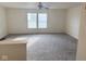 A spacious living room featuring plush carpeting and plenty of natural light at 1774 Blue Grass Pkwy, Greenwood, IN 46143