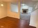 Spacious living room with hardwood floors and a stone fireplace, perfect for gatherings at 1774 Blue Grass Pkwy, Greenwood, IN 46143