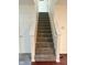 Carpeted staircase leading to the upper level of the home at 1774 Blue Grass Pkwy, Greenwood, IN 46143