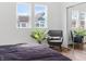 Bedroom with chair, natural light, and view of the house across the street at 1837 S East St, Indianapolis, IN 46225