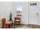 Inviting entryway with comfortable seating next to a window and entrance door at 1837 S East St, Indianapolis, IN 46225