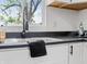 Close-up of kitchen sink and counter area, bright light from the window at 1837 S East St, Indianapolis, IN 46225