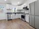 Modern kitchen with stainless steel appliances and white cabinets at 1837 S East St, Indianapolis, IN 46225