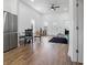 Open living room with table, chairs, new flooring, and abundant natural light at 1837 S East St, Indianapolis, IN 46225