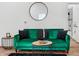 Living room featuring green velvet sofa, stylish decor, and modern accents at 1837 S East St, Indianapolis, IN 46225
