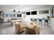 Finished basement with a pool table, bar area, comfortable seating, and white painted brick walls at 19848 Chatsworth Blvd, Westfield, IN 46074