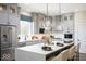 Modern kitchen with gray cabinets, stainless steel appliances, a large center island, and pendant lighting at 19848 Chatsworth Blvd, Westfield, IN 46074