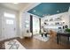 Stylish living room featuring wood floors, a modern light fixture, and a cozy seating area with an accent-colored ceiling at 19848 Chatsworth Blvd, Westfield, IN 46074