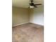 Cozy bedroom with carpet, a ceiling fan, neutral walls, and ample space for customization at 2026 S Q St, Elwood, IN 46036
