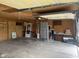 Spacious garage featuring ample storage, a work bench, and garage door with opener system at 2026 S Q St, Elwood, IN 46036