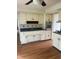 Functional kitchen with white cabinetry, blue countertops, stainless steel appliances, and a vinyl floor at 2026 S Q St, Elwood, IN 46036