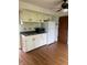 Practical kitchen with ample storage, a white refrigerator, laminate floors, and traditional cabinets at 2026 S Q St, Elwood, IN 46036