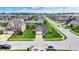 Aerial view of a well-maintained neighborhood showcasing lush green lawns and tree-lined streets at 2201 Schoolmarm Dr, Greenfield, IN 46140