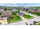 Aerial view of a well-planned suburban community with tree-lined streets and manicured lawns at 2201 Schoolmarm Dr, Greenfield, IN 46140