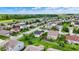 Scenic aerial view of a neighborhood with well-kept lawns, mature trees, and houses with fenced yards at 2201 Schoolmarm Dr, Greenfield, IN 46140