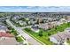 Detailed aerial view of neighborhood featuring manicured lawns and backyard amenities such as trampoline at 2201 Schoolmarm Dr, Greenfield, IN 46140
